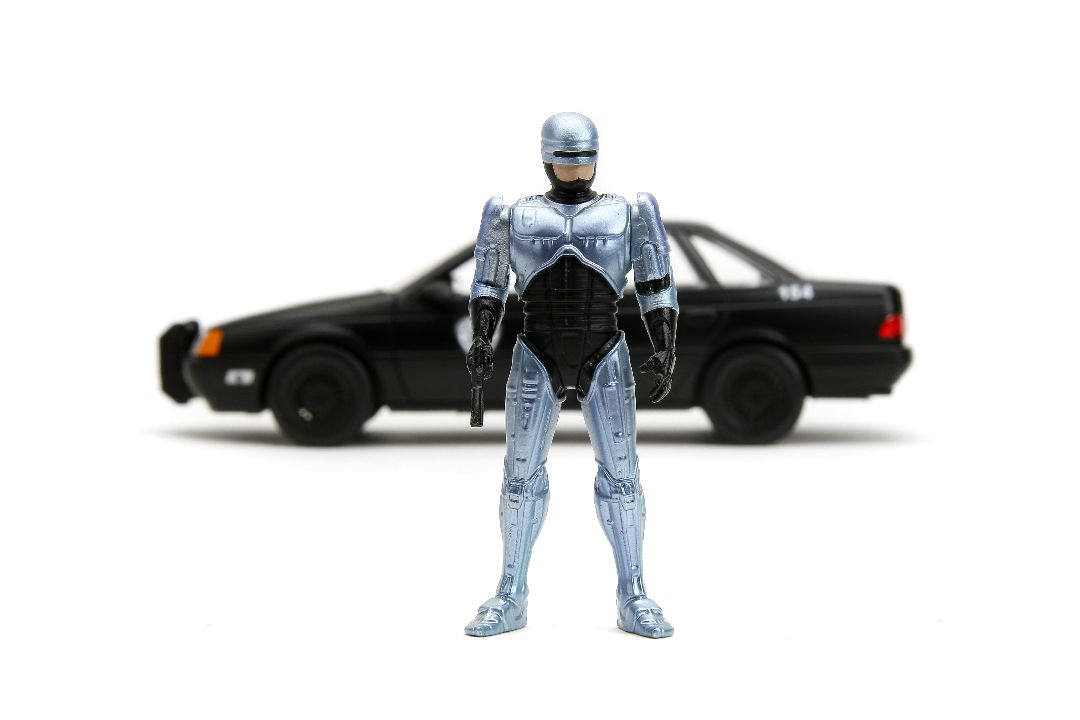 Jada 1/24 "Hollywood Rides" 1986 OCP Ford Taurus w/ RoboCop – image 5