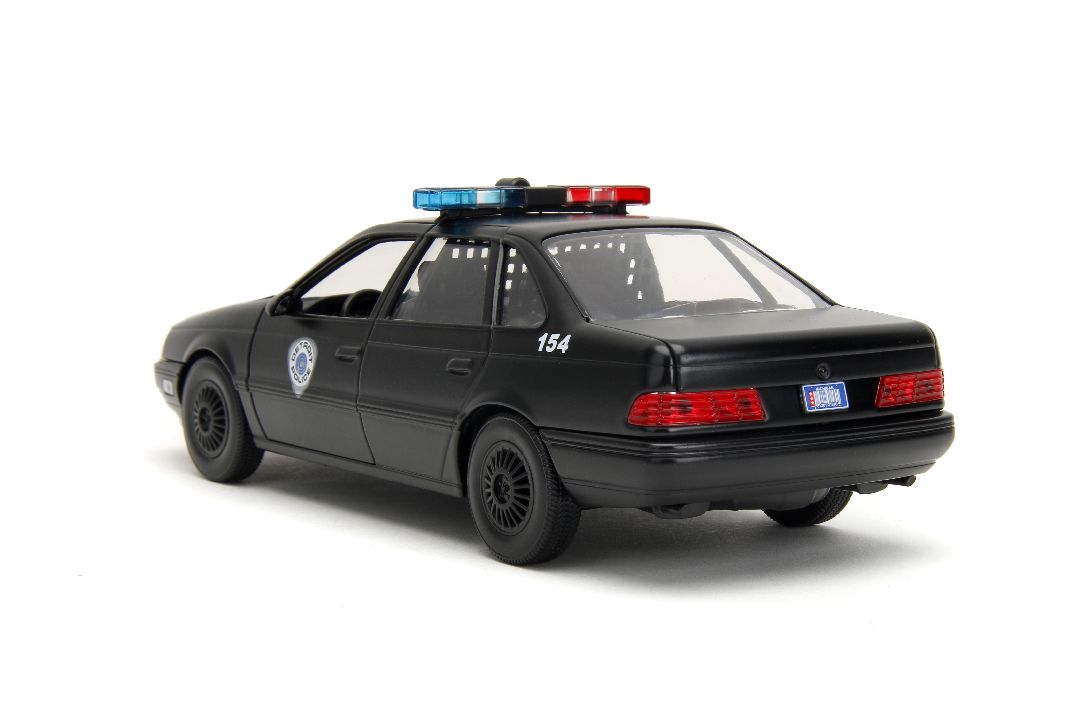 Jada 1/24 "Hollywood Rides" 1986 OCP Ford Taurus w/ RoboCop – image 9