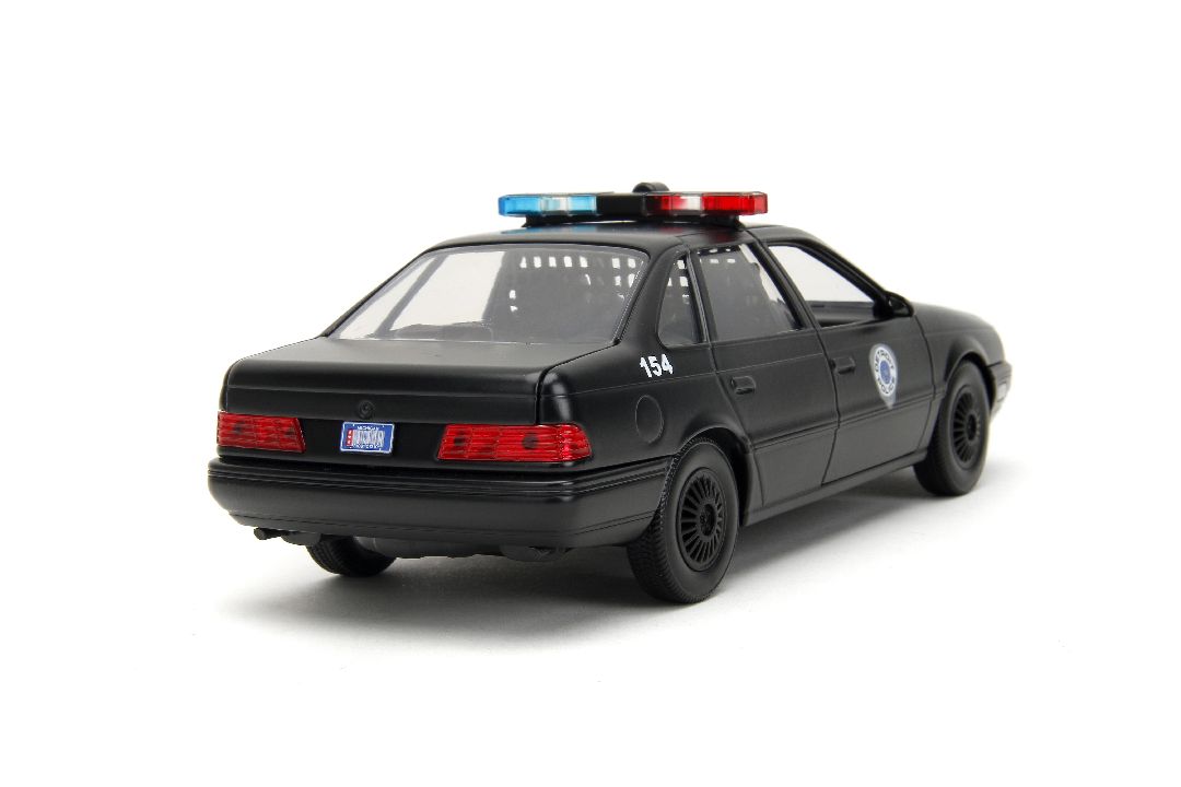 Jada 1/24 "Hollywood Rides" 1986 OCP Ford Taurus w/ RoboCop – image 13