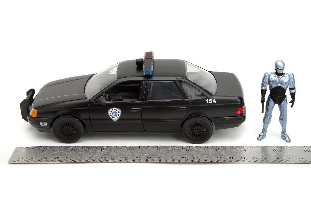 Jada 1/24 "Hollywood Rides" 1986 OCP Ford Taurus w/ RoboCop – image 20